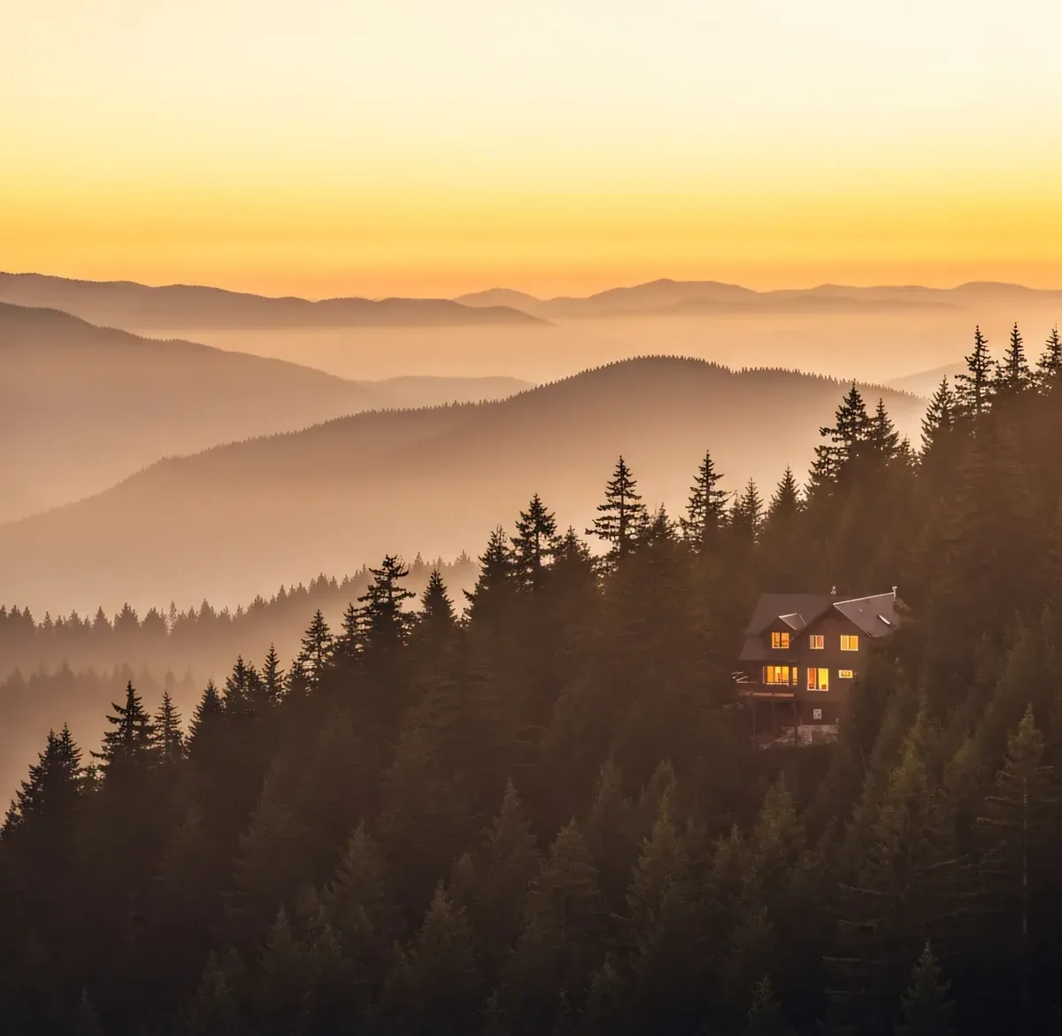 An evergreen ridge at dusk with a single lit rental below the tree line, one property whose season is decided by a few dozen pricing decisions nobody sees.