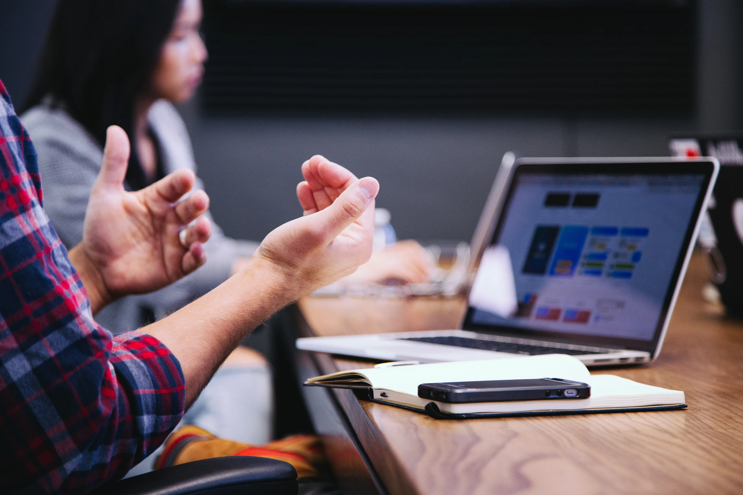A laptop open to a booking calendar and a spreadsheet beside a coffee — the ninety-minute orphan audit needs an export and a spreadsheet, not a tool.